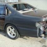 Before and after photographs of a damaged Chevy Impala that was repaired by Elite Paint & Body Shop in West Palm Beach, Florida.